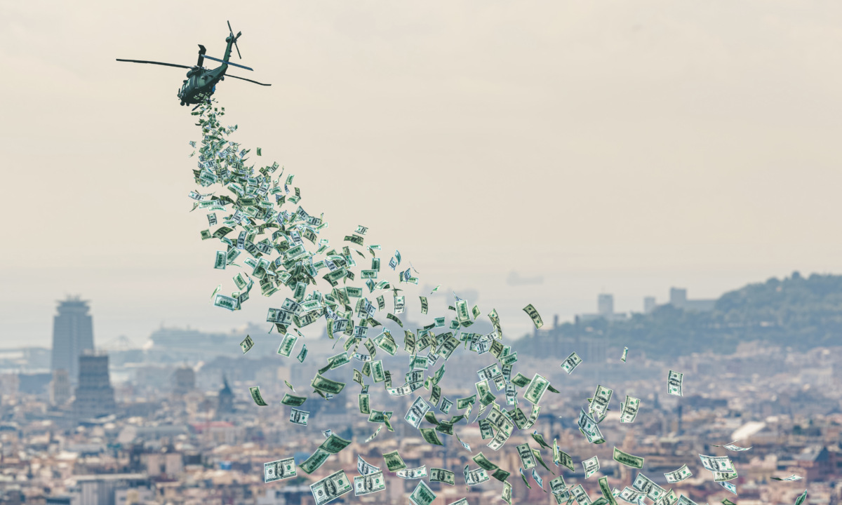 helicopter flies over a city and distributes money