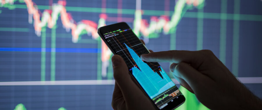 Businessman checking stock market data. Businessman checking stock market data. He using a mobile phone. Analysis economy data on forex earn graph.