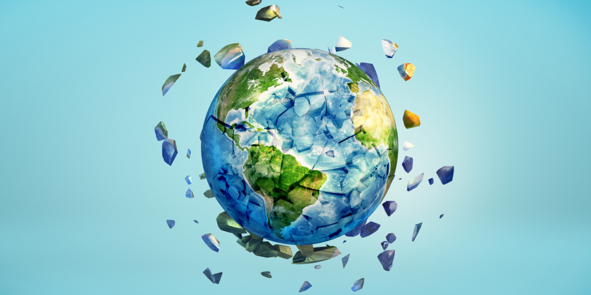 3d rendering of Earth globe getting crushed into small pieces with the cracked parts flying away.