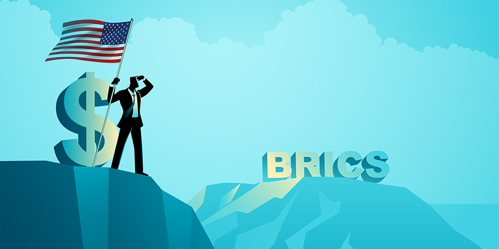 Businessman with a dollar symbol, holding the U.S. flag and gazing into the distance toward the letters BRICS emerges from a mountaintop. Symbolizes economic rivalry and global power shifts